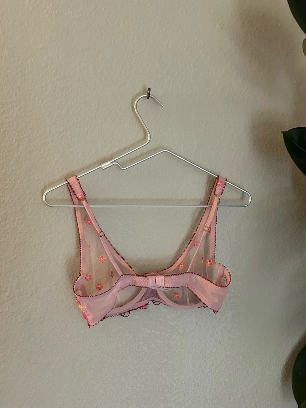 Out from under pink floral embroidered  underwire bra